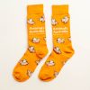 Orange socks with flying pigs over them and the AA logo in white