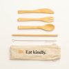 Bamboo fork, spoon, knife, straw and metal straw cleaner. With beige carry bag that has the AA logo in orange and the words 'Eat kindly.'