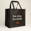 Black shopper bag with orange Animals Australia logo and a quote - "Eat, shop, live kindly"